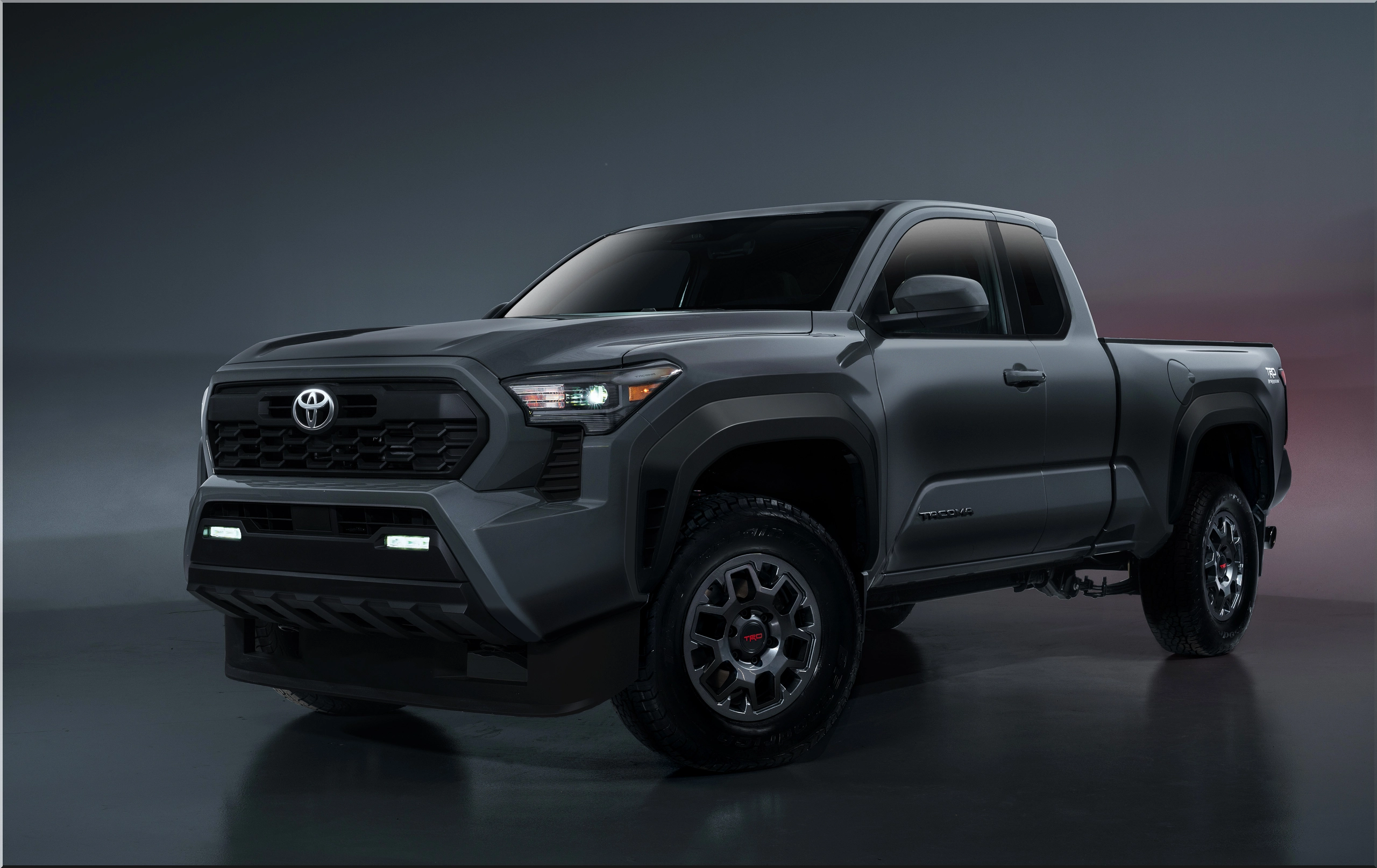 2026 Toyota Tacoma front view on rugged terrain