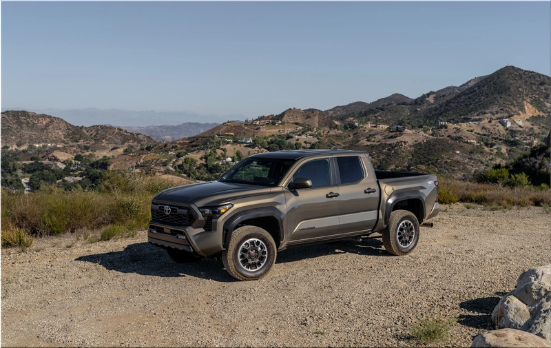 2026 Toyota Tacoma side profile with mountains in background
